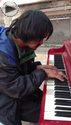 homeless piano player